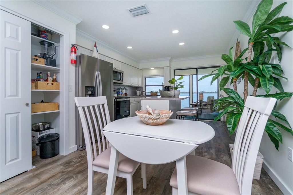 5041 North Beach Road, Unit 3A AND 3B Englewood, FL 34223 - Photo 33 of 52 a view of a dining room with furniture