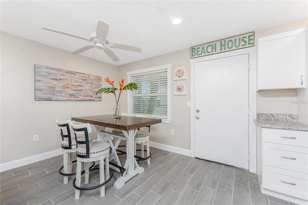 5041 North Beach Road, Unit 3A AND 3B Englewood, FL 34223 - Photo 9 of 52 a dining room with furniture and window