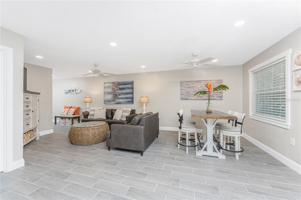 5041 North Beach Road, Unit 3A AND 3B Englewood, FL 34223 - Photo 10 of 52 a living room with furniture and a wooden floor