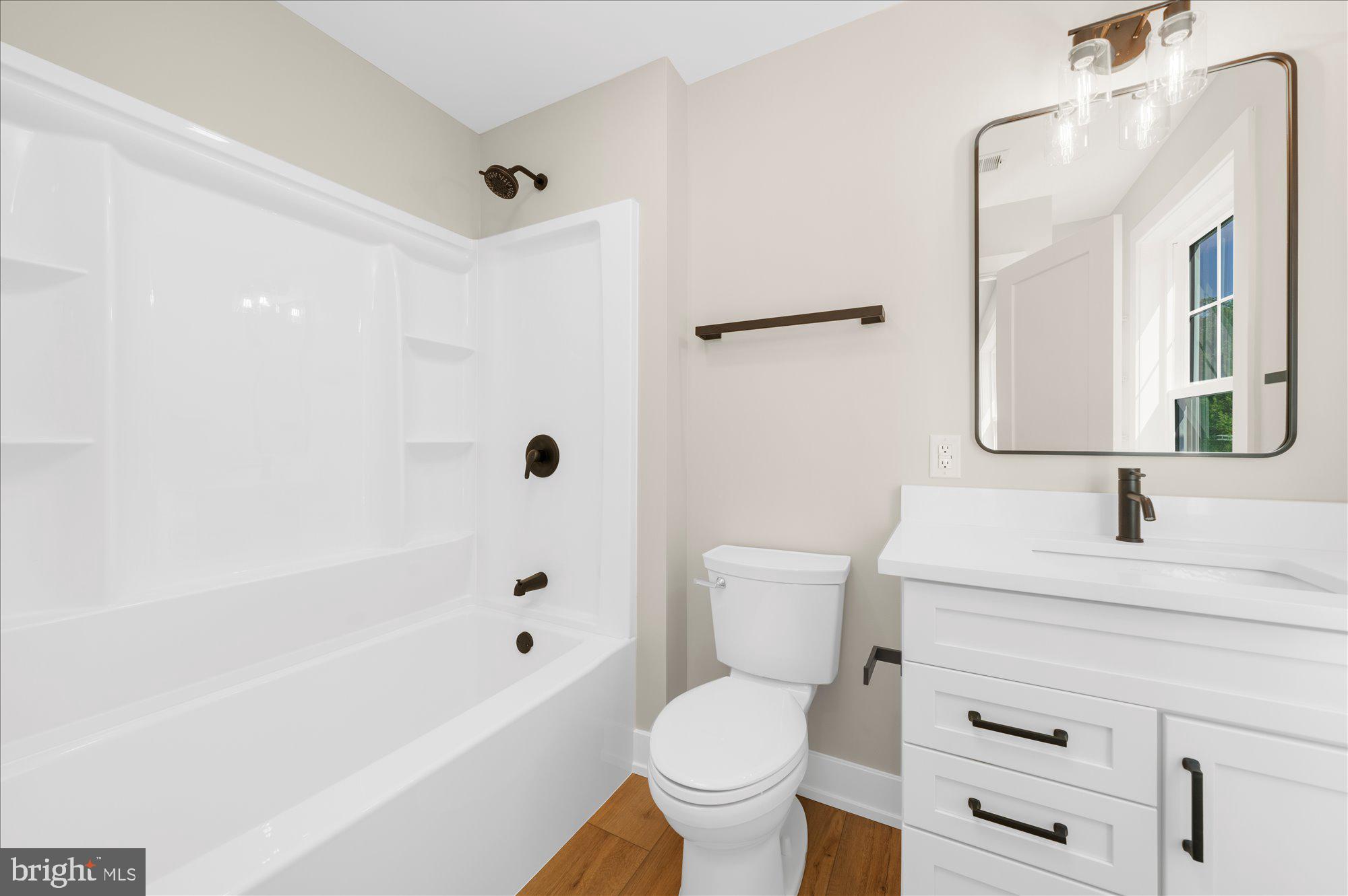394 Renninger Road Perkiomenville, PA 18074 - Photo 31 of 41 a bathroom with a sink toilet vanity and shower