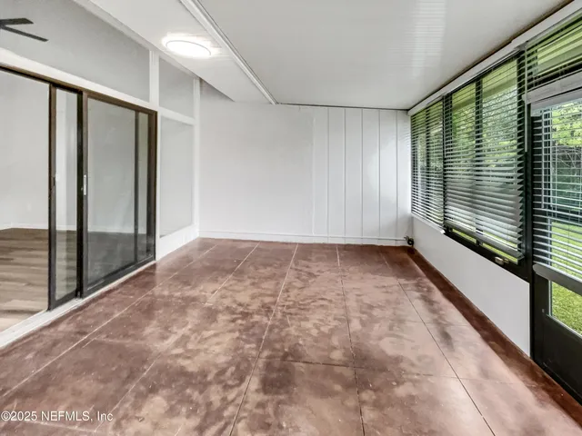 a view of an empty room and window