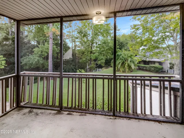a view of a balcony with an outdoor space