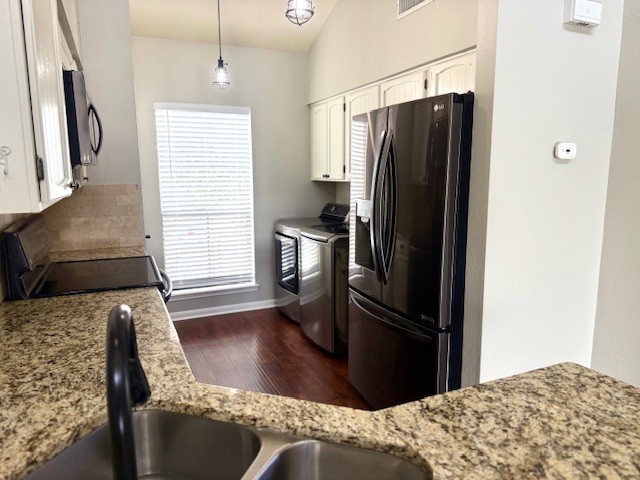 178 April Point Drive North Montgomery, TX 77356 - Photo 3 of 17 a kitchen with stainless steel appliances granite countertop a refrigerator stove and microwave