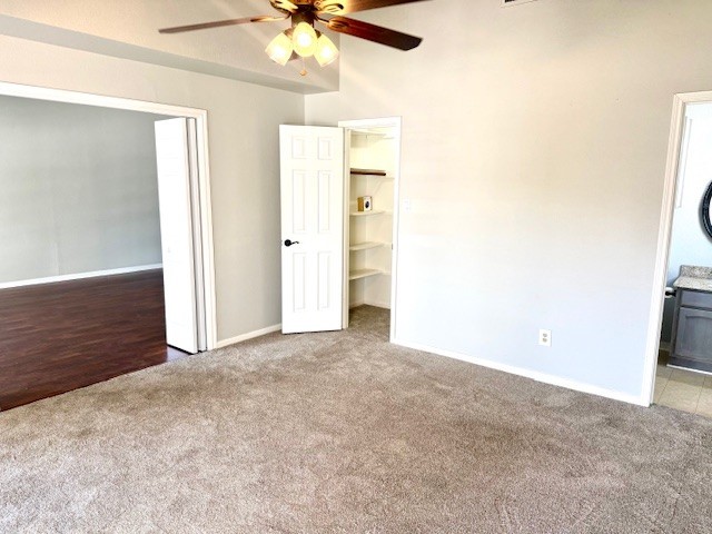 178 April Point Drive North Montgomery, TX 77356 - Photo 6 of 17 an empty room with a chandelier fan and windows