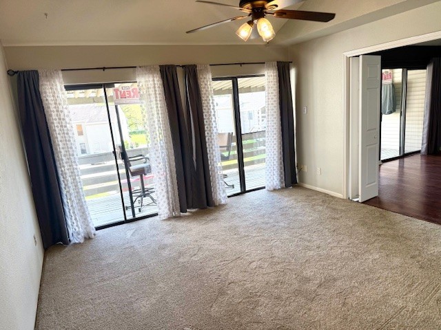 178 April Point Drive North Montgomery, TX 77356 - Photo 7 of 17 an empty room with chandelier fan and windows