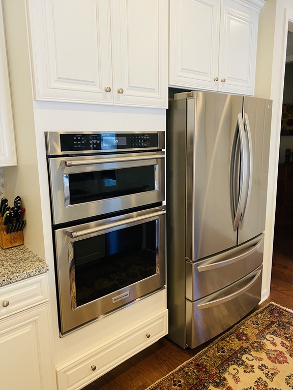 41 Shannon Way, Unit 41 Upton, MA 01568 - Photo 12 of 36 a close view of a stove top oven sitting inside of a kitchen