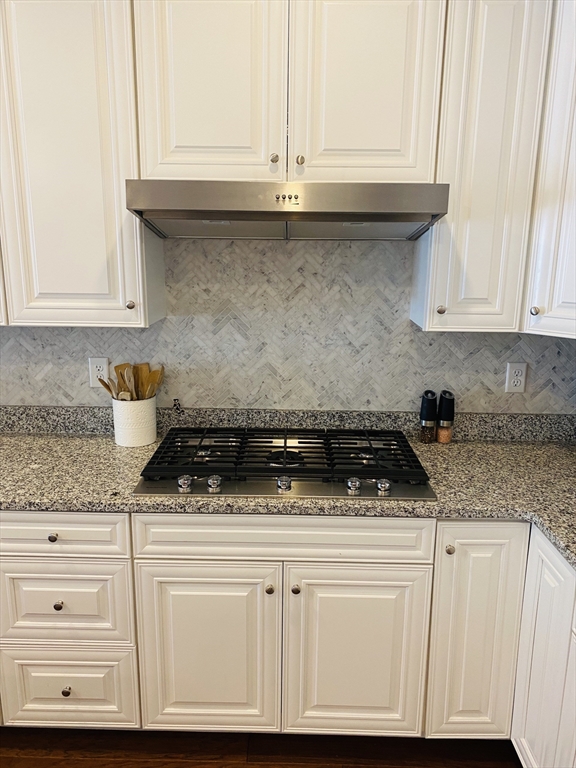 41 Shannon Way, Unit 41 Upton, MA 01568 - Photo 13 of 36 a kitchen with white cabinets and appliances