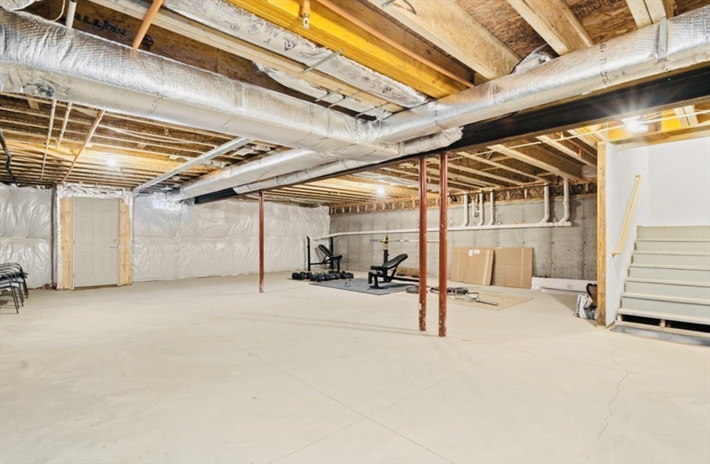 41 Shannon Way, Unit 41 Upton, MA 01568 - Photo 28 of 36 a view of a garage with wooden roof