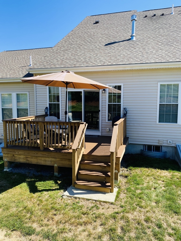 41 Shannon Way, Unit 41 Upton, MA 01568 - Photo 30 of 36 a view of a chairs and table in the patio