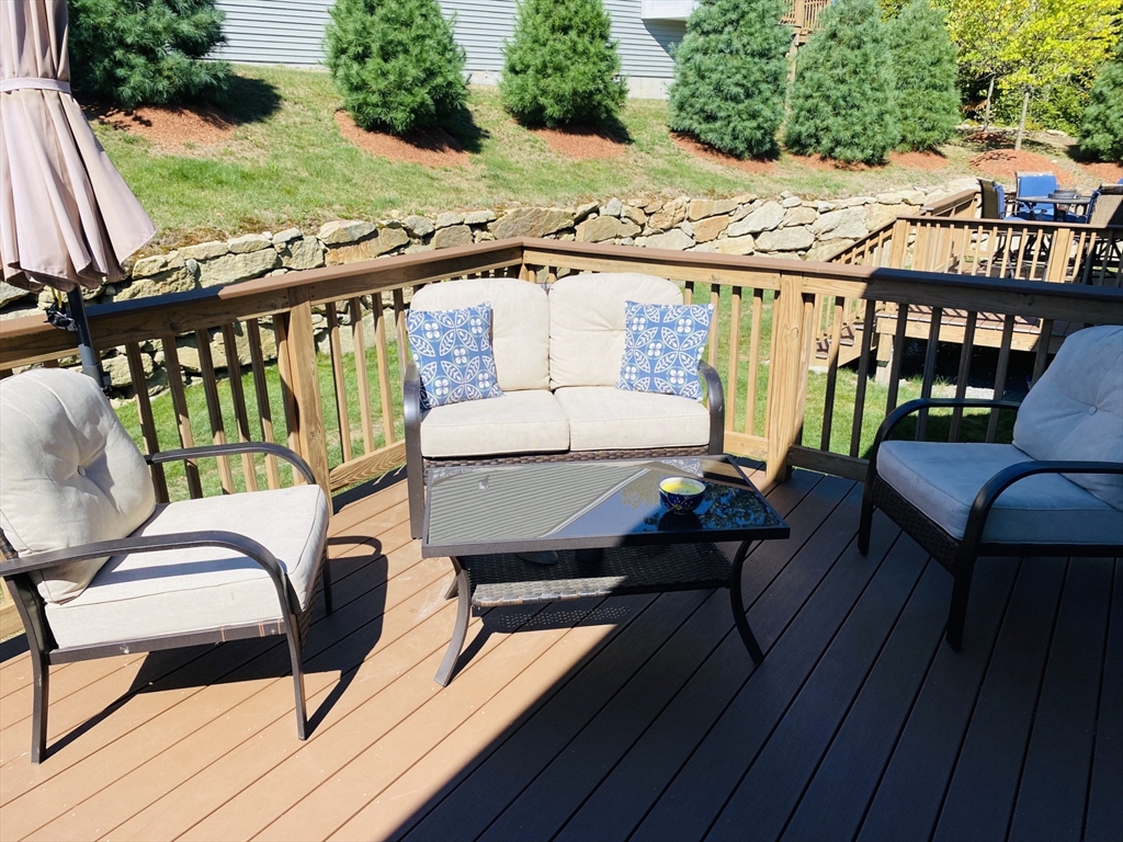 41 Shannon Way, Unit 41 Upton, MA 01568 - Photo 32 of 36 a view of a balcony with furniture