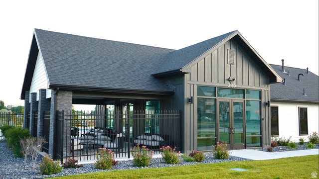 412 West 3025th Street South Logan, UT 84321 - Photo 32 of 34 Modern clubhouse structure featuring board-and-batten siding and expansive glass doors
