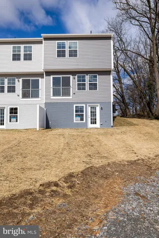 a large building with a large pool in front of it