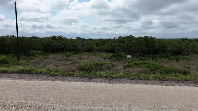 a view of a road with a yard