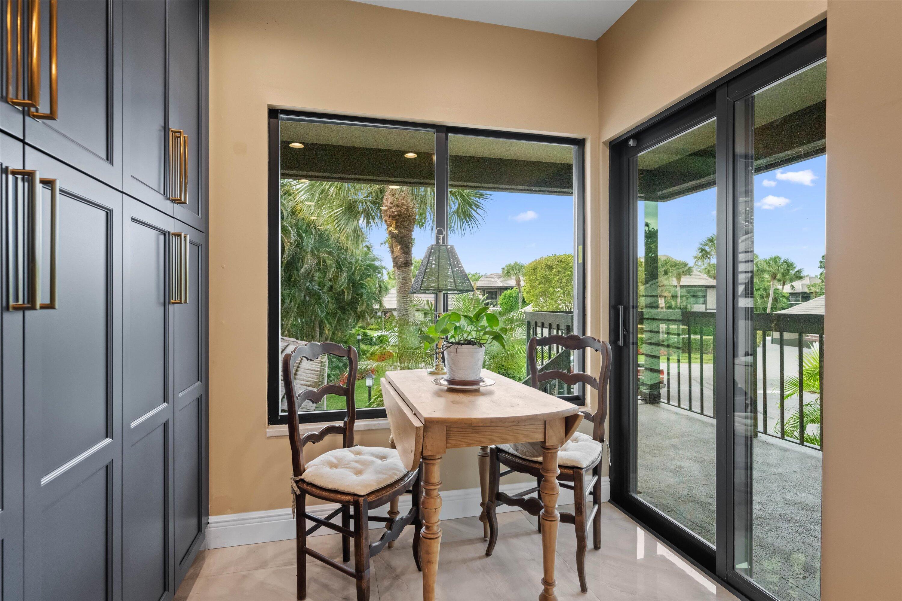 13254 Polo Club Road, Unit C202 Wellington, FL 33414 - Photo 14 of 27 a dining room with furniture and window