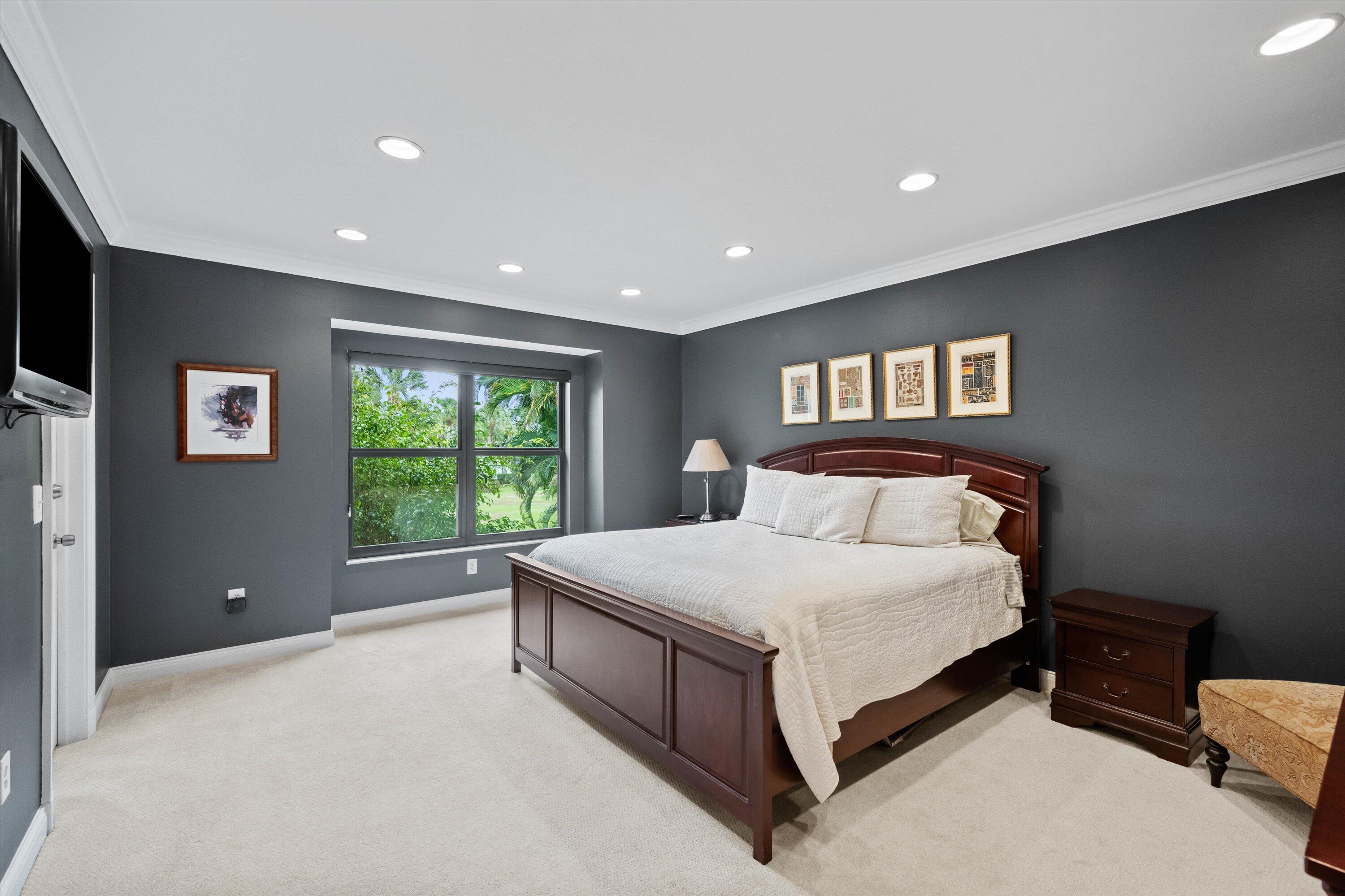 13254 Polo Club Road, Unit C202 Wellington, FL 33414 - Photo 15 of 27 a large bedroom with a bed and large window