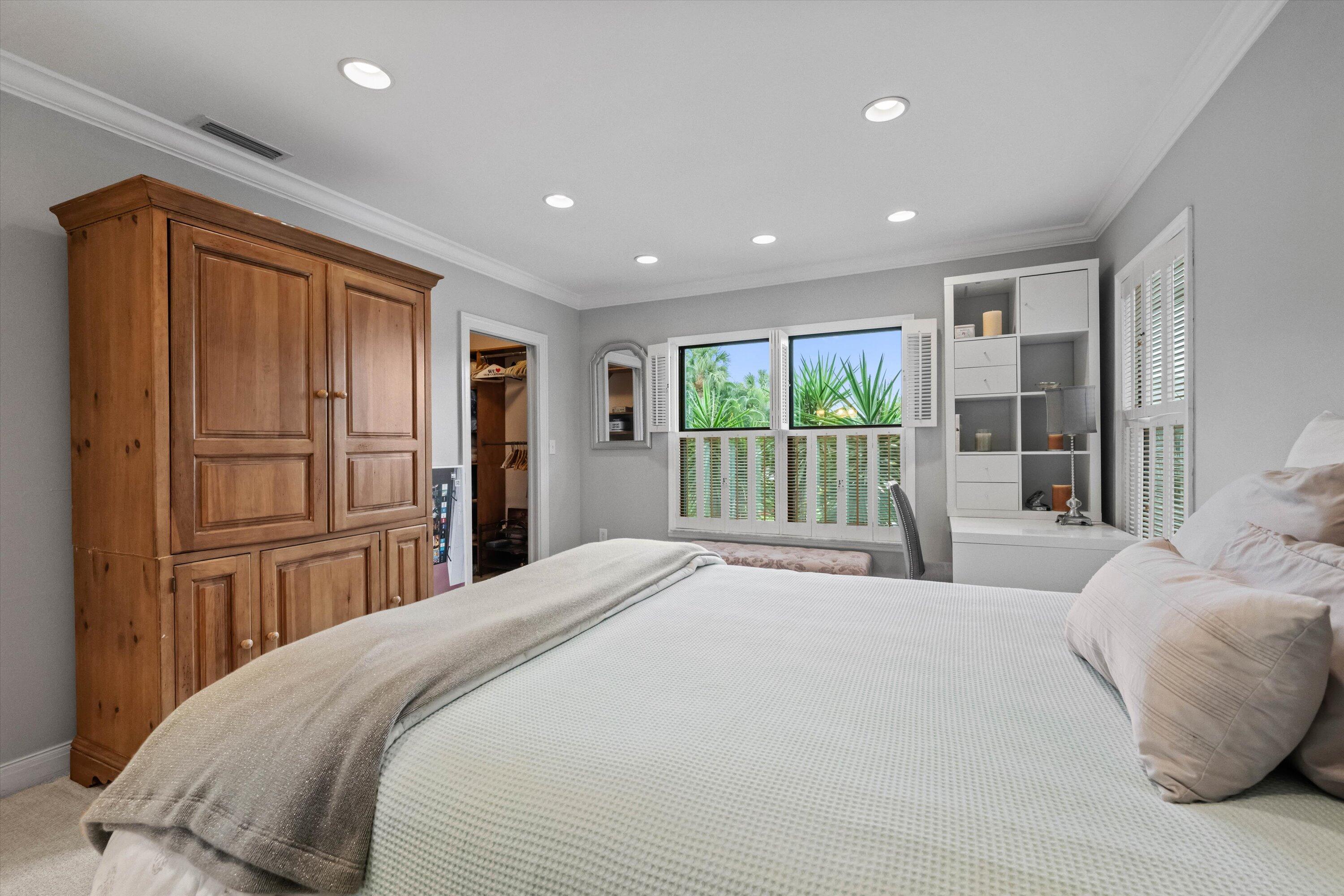 13254 Polo Club Road, Unit C202 Wellington, FL 33414 - Photo 23 of 27 a bedroom with a large bed closet and window