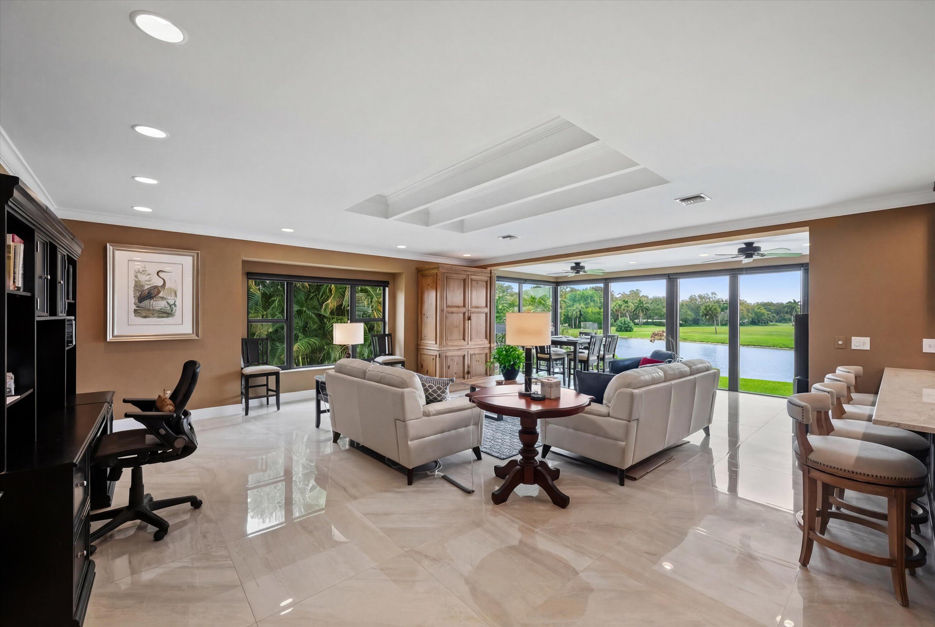 13254 Polo Club Road, Unit C202 Wellington, FL 33414 - Photo 4 of 27 a living room with furniture and a large window