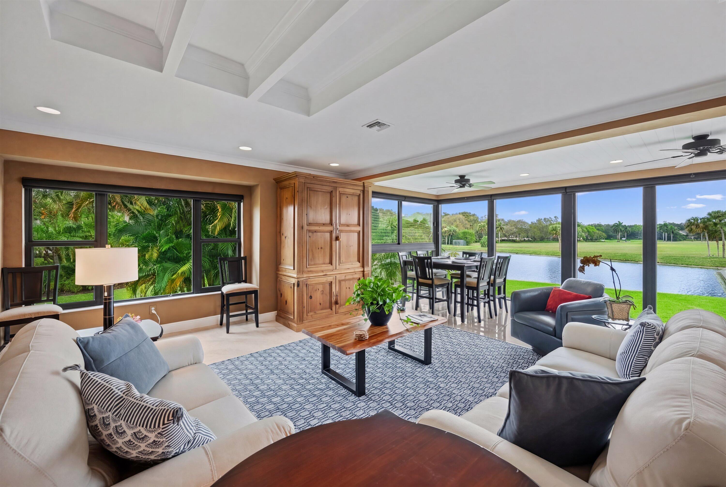 13254 Polo Club Road, Unit C202 Wellington, FL 33414 - Photo 6 of 27 a living room with furniture and a large window