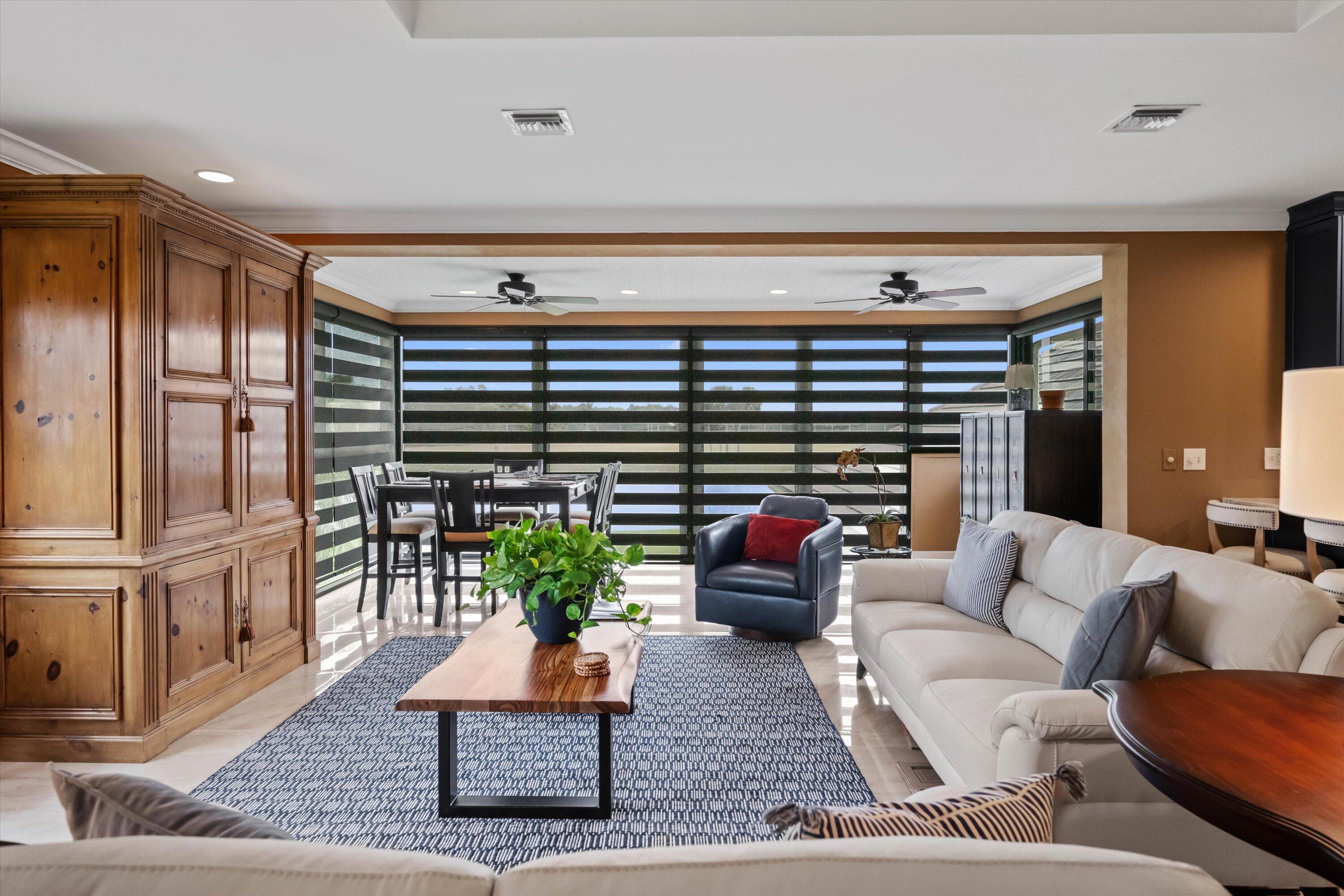 13254 Polo Club Road, Unit C202 Wellington, FL 33414 - Photo 7 of 27 a living room with furniture and a potted plant
