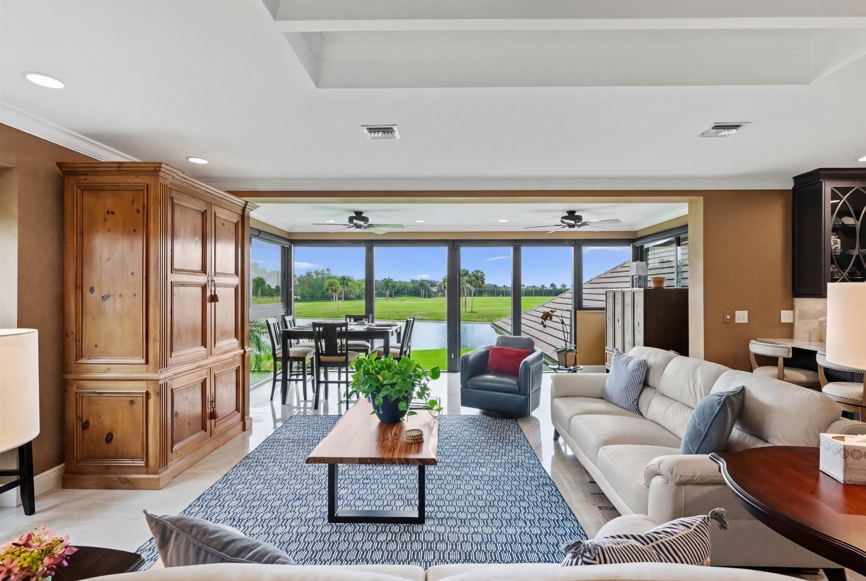 13254 Polo Club Road, Unit C202 Wellington, FL 33414 - Photo 8 of 27 a living room with furniture fireplace and a large window