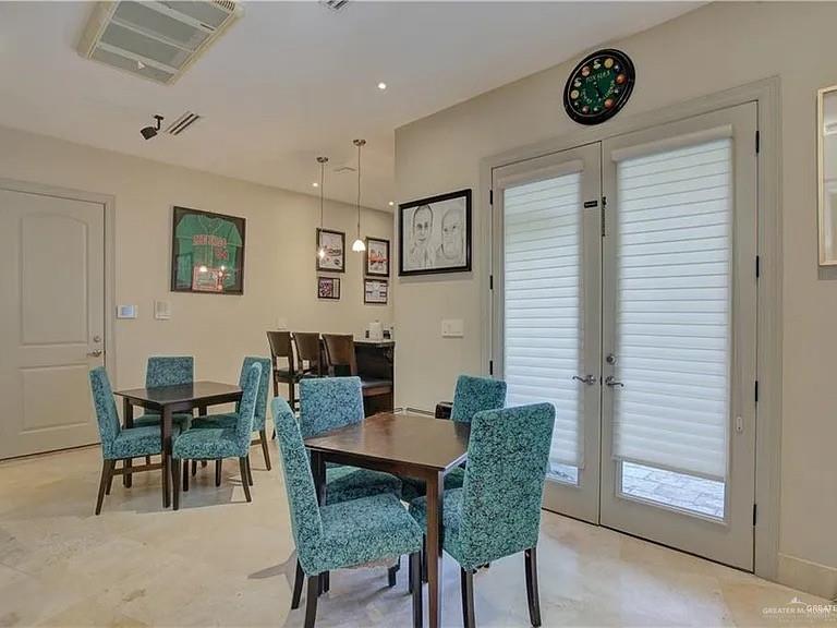 3429 South 3rd Street McAllen, TX 78503 - Photo 11 of 25 a view of a dining room with furniture and wooden floor