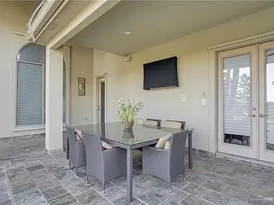 a dining room with furniture and window