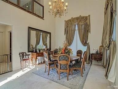 3429 South 3rd Street McAllen, TX 78503 - Photo 4 of 25 a view of a dining room with furniture and chandelier