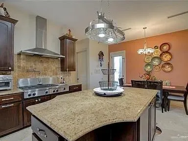 a kitchen with a table and chairs in it