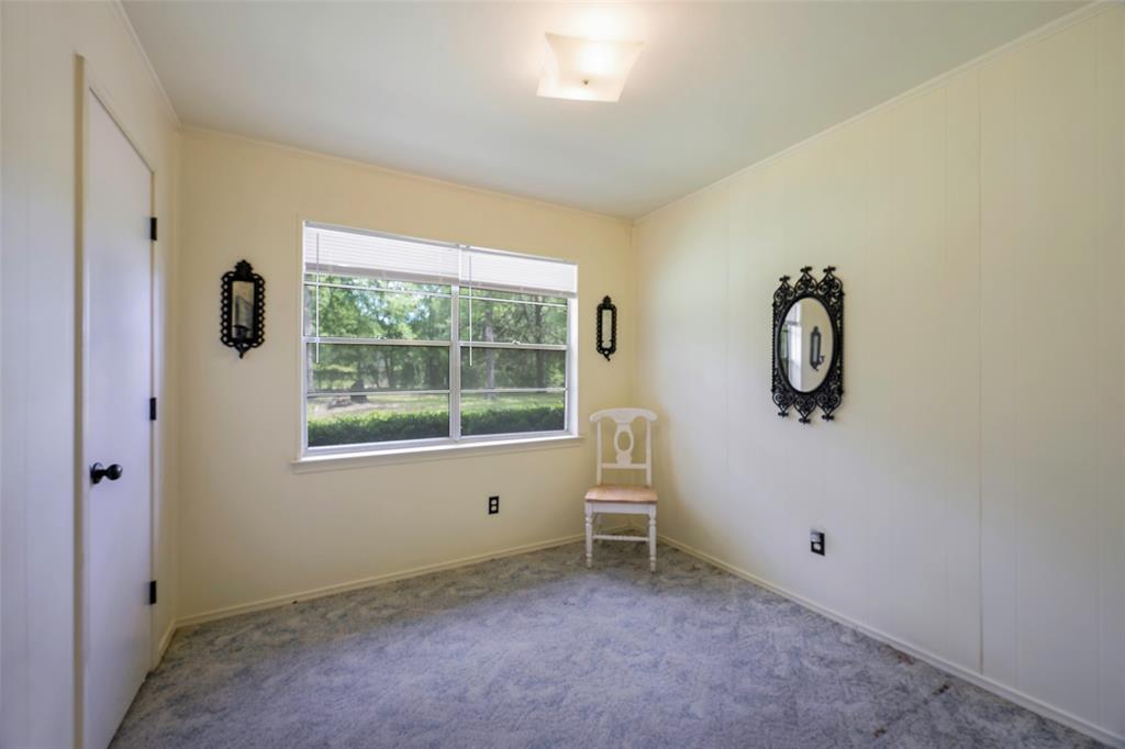 1113 West Will White Road Kemp, TX 75143 - Photo 12 of 22 an empty room with windows