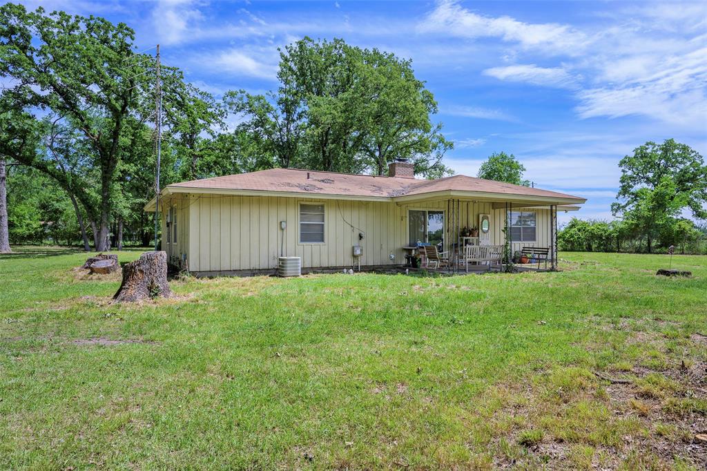 1113 West Will White Road Kemp, TX 75143 - Photo 17 of 22 a view of a house with a backyard
