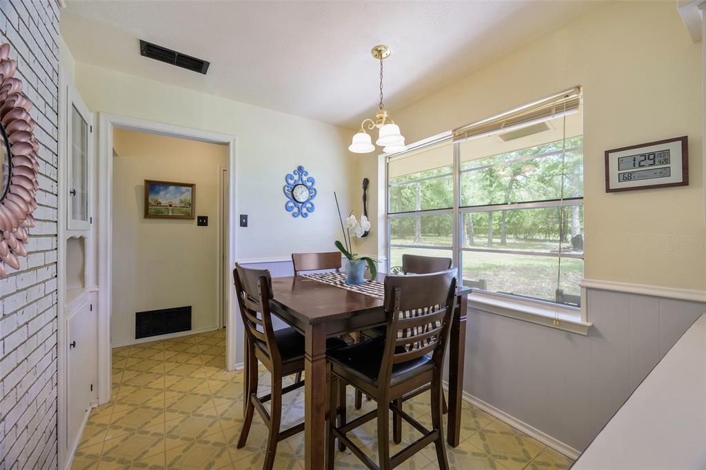 1113 West Will White Road Kemp, TX 75143 - Photo 10 of 22 a view of a dining room with furniture window and outside view