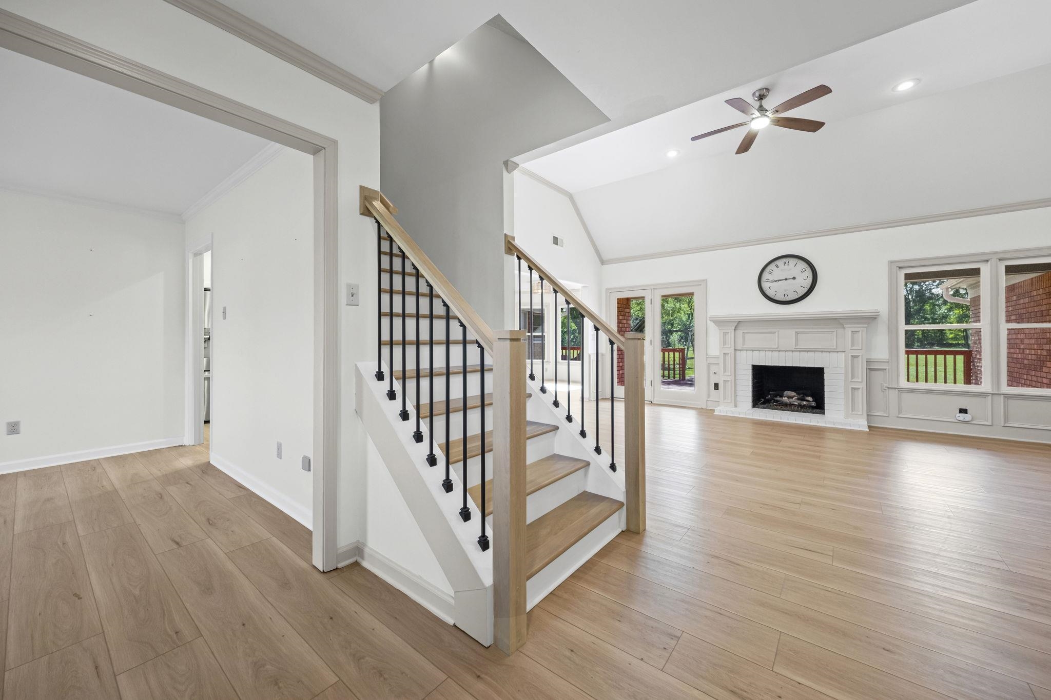 10661 Chapel Hill Road Lakeland, TN 38002 - Photo 13 of 40 a view of entryway with wooden floor and fireplace