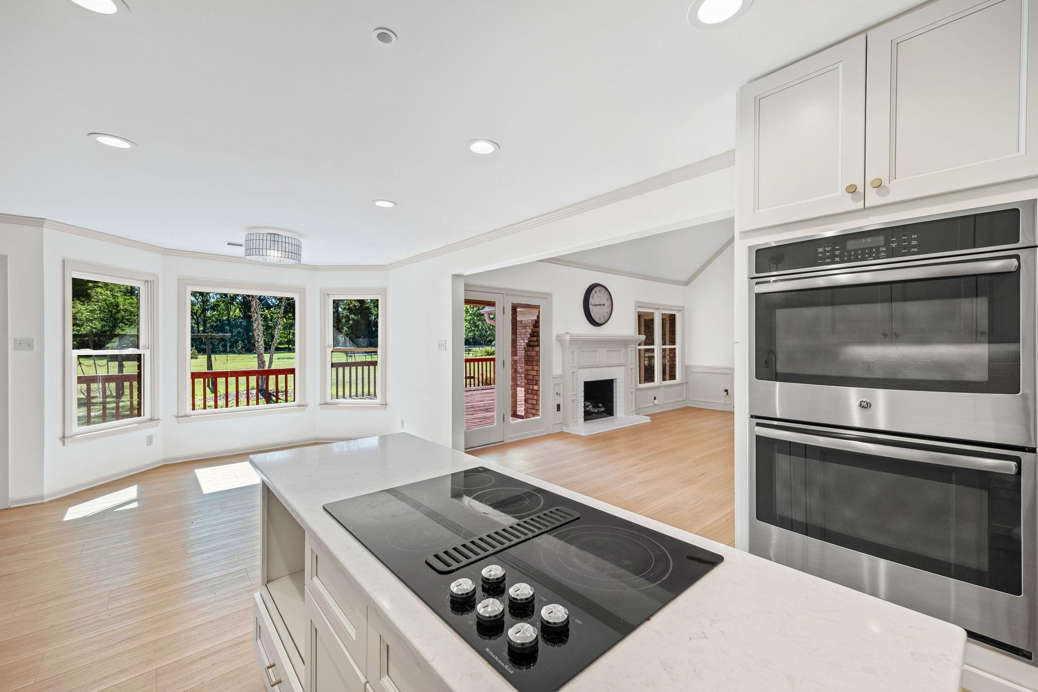 10661 Chapel Hill Road Lakeland, TN 38002 - Photo 19 of 40 a kitchen with stainless steel appliances granite countertop a stove and a refrigerator