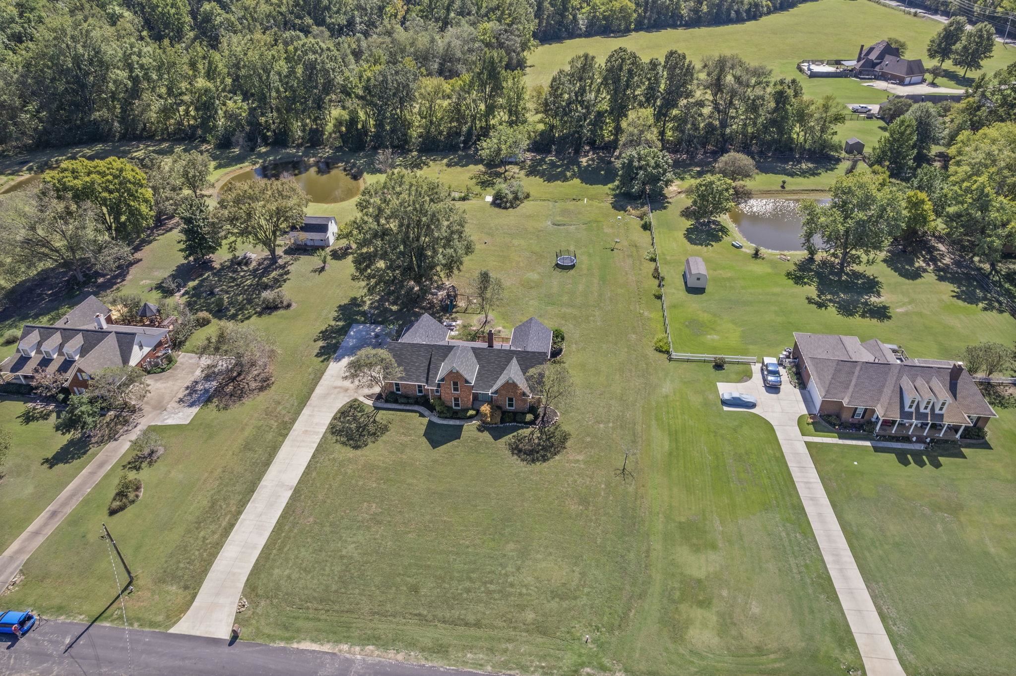 10661 Chapel Hill Road Lakeland, TN 38002 - Photo 2 of 40 an aerial view of residential houses with outdoor space