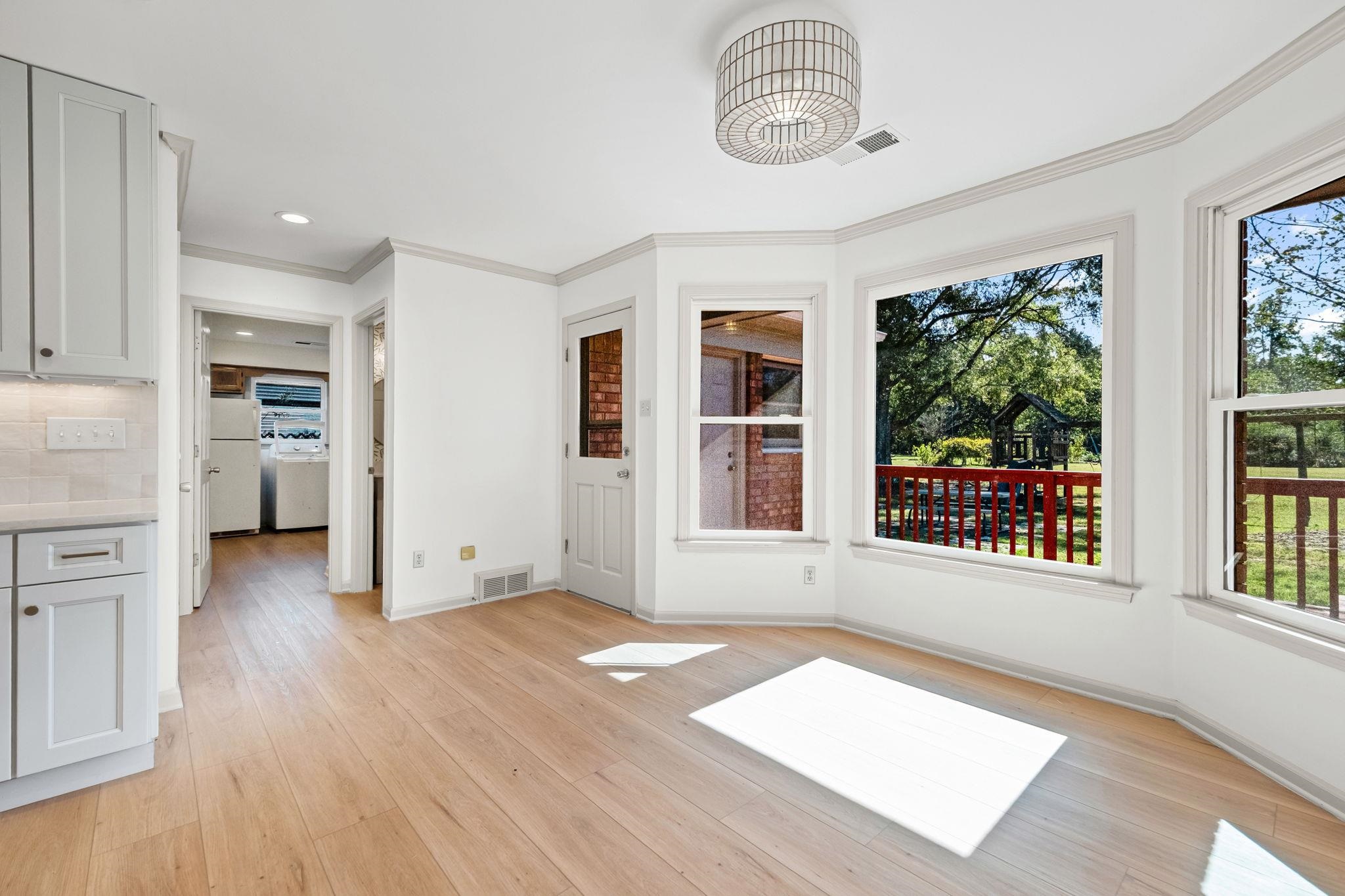 10661 Chapel Hill Road Lakeland, TN 38002 - Photo 20 of 40 an empty room with wooden floor and windows