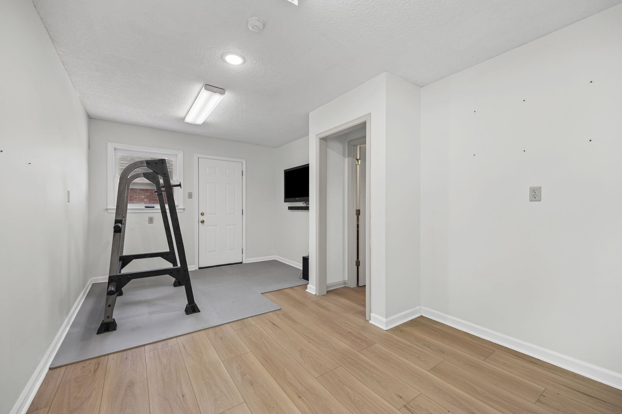 10661 Chapel Hill Road Lakeland, TN 38002 - Photo 22 of 40 a view of a room with gym equipment