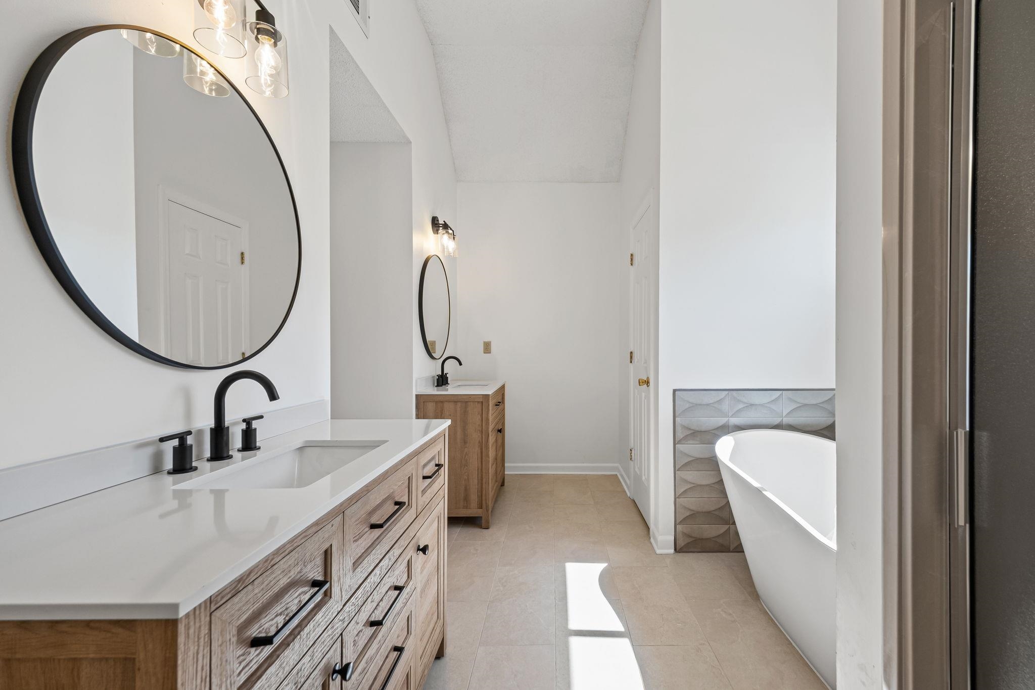 10661 Chapel Hill Road Lakeland, TN 38002 - Photo 29 of 40 a en suite bathroom with a sink and a mirror