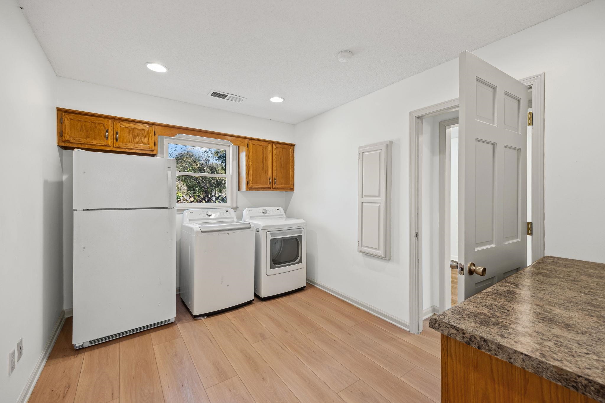 10661 Chapel Hill Road Lakeland, TN 38002 - Photo 33 of 40 a view of a kitchen with a sink refrigerator and window