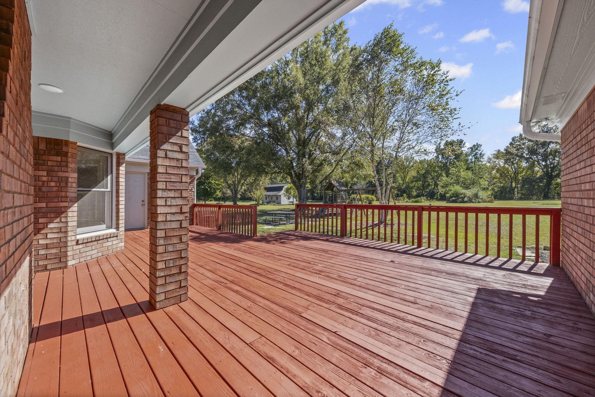 10661 Chapel Hill Road Lakeland, TN 38002 - Photo 37 of 40 a view of deck with wooden floor and fence