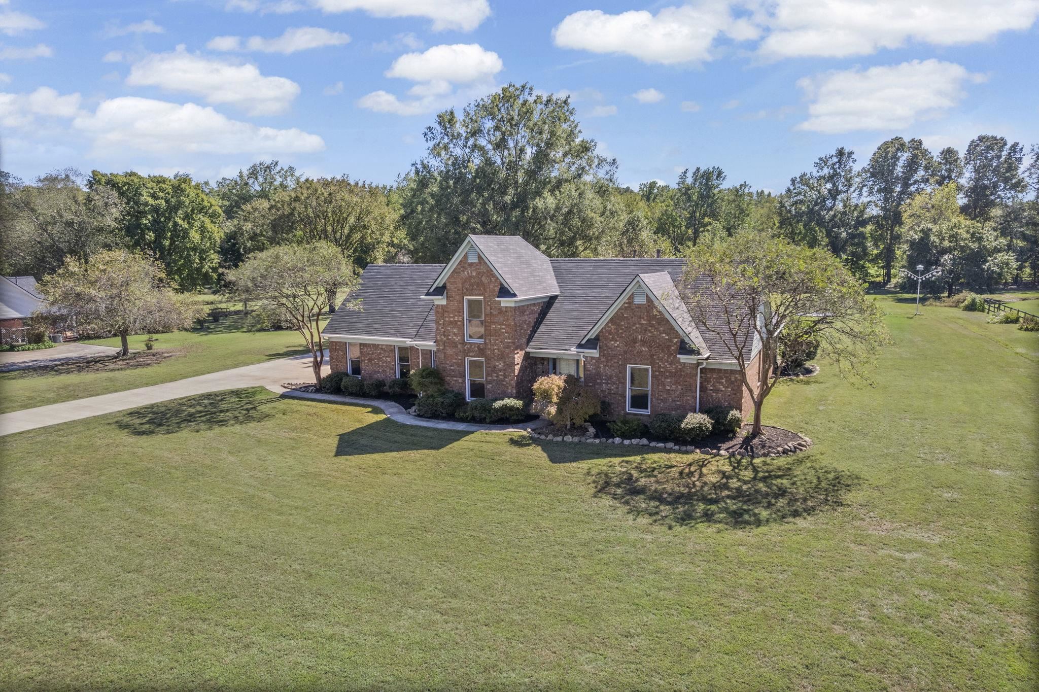 10661 Chapel Hill Road Lakeland, TN 38002 - Photo 4 of 40 a aerial view of a house with a big yard