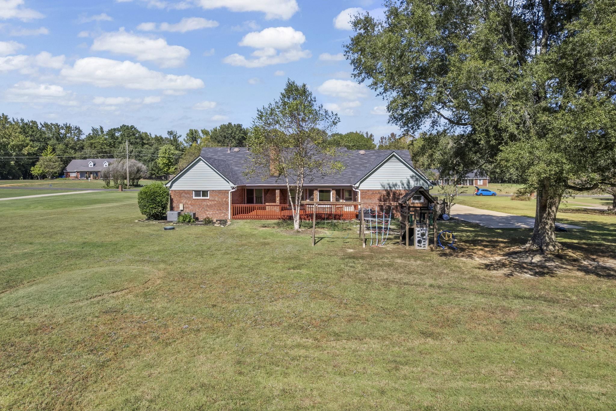 10661 Chapel Hill Road Lakeland, TN 38002 - Photo 6 of 40 a view of house with outdoor space and porch