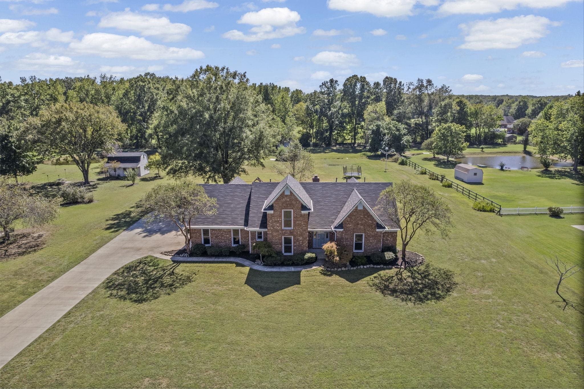 10661 Chapel Hill Road Lakeland, TN 38002 - Photo 7 of 40 an aerial view of a house with a yard basket ball court and outdoor seating