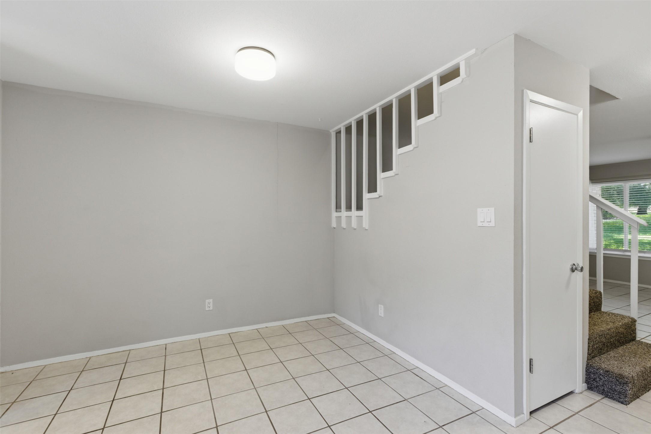 4204 Hudson Bend Road, Unit B Austin, TX 78734 - Photo 12 of 37 Bright interior space featuring light-colored tile flooring