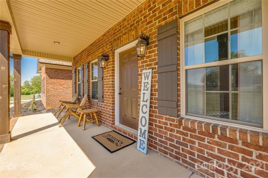 5809 Sikes Mill Road Monroe, NC 28110 - Photo 2 of 32 a view of front door with outdoor seating