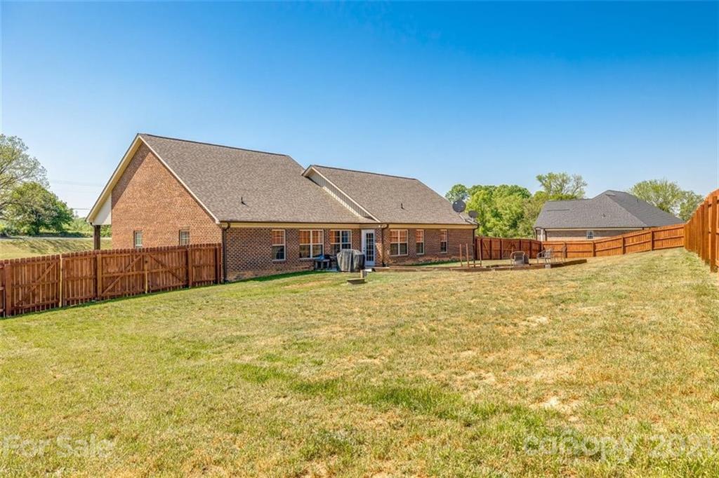 5809 Sikes Mill Road Monroe, NC 28110 - Photo 25 of 32 a view of house with an outdoor space and seating