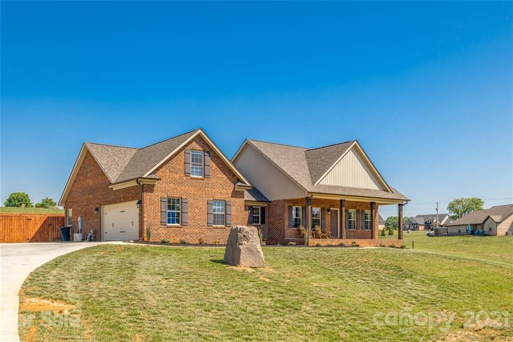 5809 Sikes Mill Road Monroe, NC 28110 - Photo 27 of 32 a front view of a house with a yard