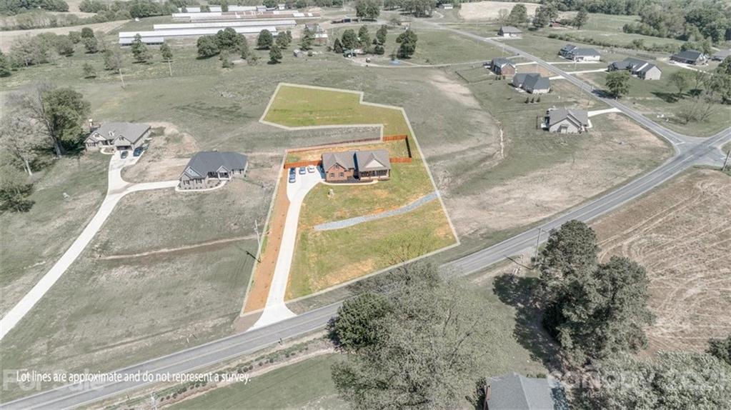 5809 Sikes Mill Road Monroe, NC 28110 - Photo 28 of 32 an aerial view of a house with a yard