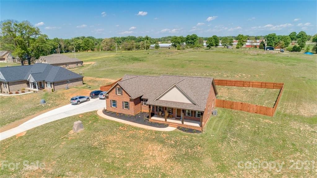 5809 Sikes Mill Road Monroe, NC 28110 - Photo 32 of 32 an aerial view of a house with a yard
