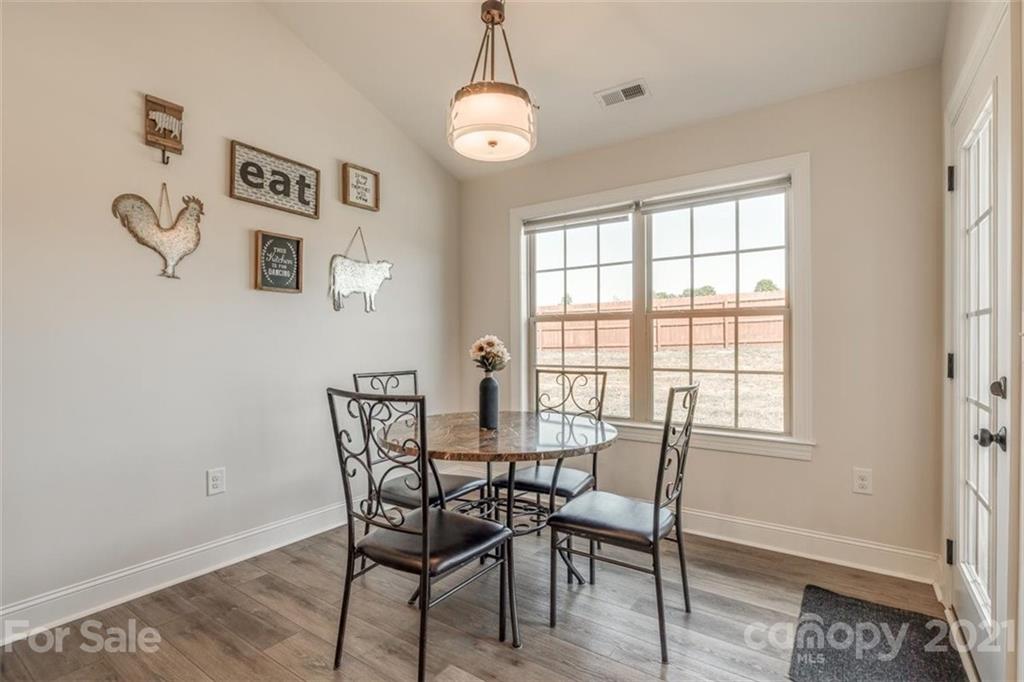 5809 Sikes Mill Road Monroe, NC 28110 - Photo 8 of 32 a view of a dining room with furniture and window