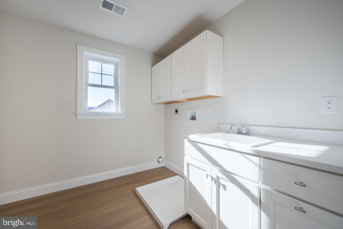 548 Old Forge Road, Unit 1 Media, PA 19063 - Photo 24 of 37 a utility room with cabinets washer and dryer